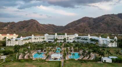 Scenic view of a luxury resort in Matapalo, Costa Rica with mountain backdrop.