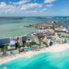 Stunning aerial shot of Cancun's pristine beaches and luxury resorts along the coast.