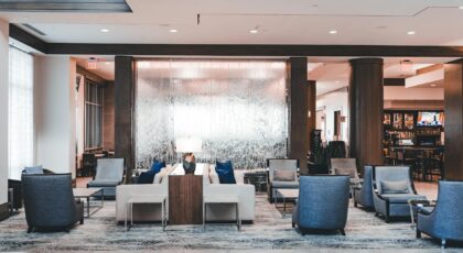 Spacious modern hotel lobby with elegant seating, perfect for relaxation and socializing.