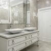 Sophisticated bathroom design featuring dual sinks, luxury decor, and modern elegance.