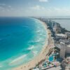 Breathtaking aerial photograph capturing Cancun's clear blue waters and vibrant cityscape.