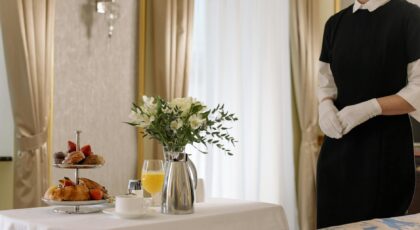 Elegant hotel room service setup with delicious breakfast and attentive service.