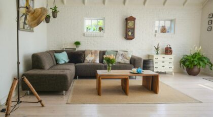 Stylish living room interior featuring a cozy couch, decor accents, and natural elements.